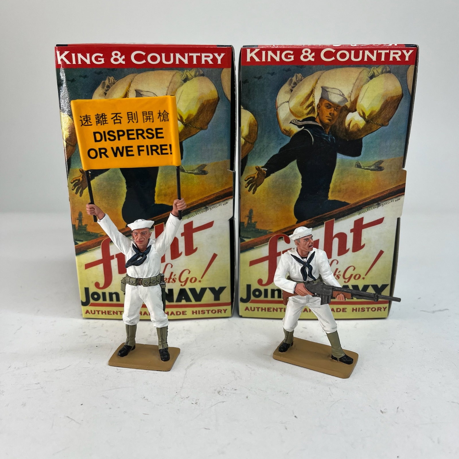 King & Country U.S. Navy Banner Man and Bar Gunner: USN009 and USN011. 2 Pieces. Condition Excellent. Boxes Very Good.