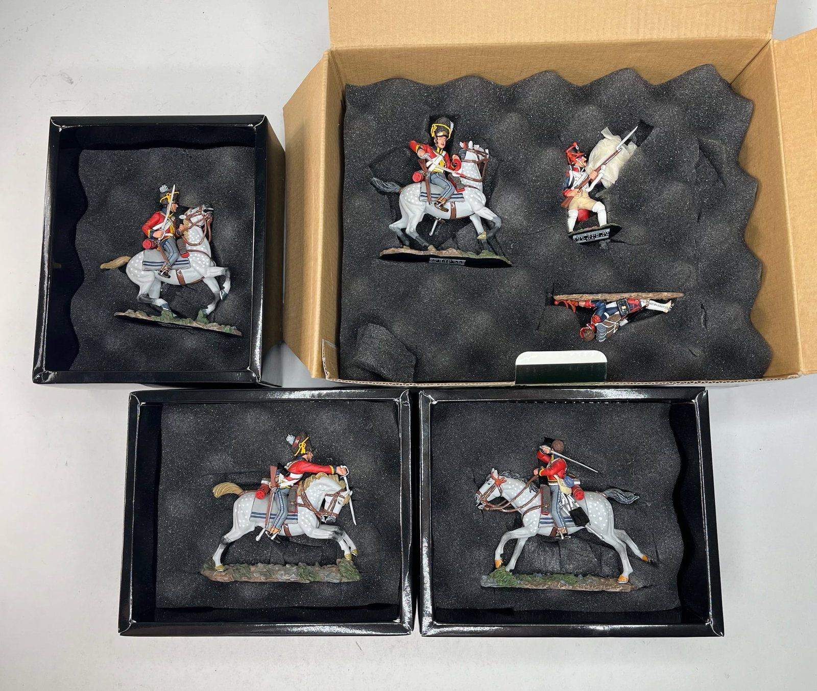 King & Country Age of Napoleon Assortment: NA086 Scots Grey Slashing, NA087 Seizing the Colour, NA089 Rearing Horse, and NA090 Charging Sword Down. 6 Pieces. Condition Excellent. Boxes Very Good.