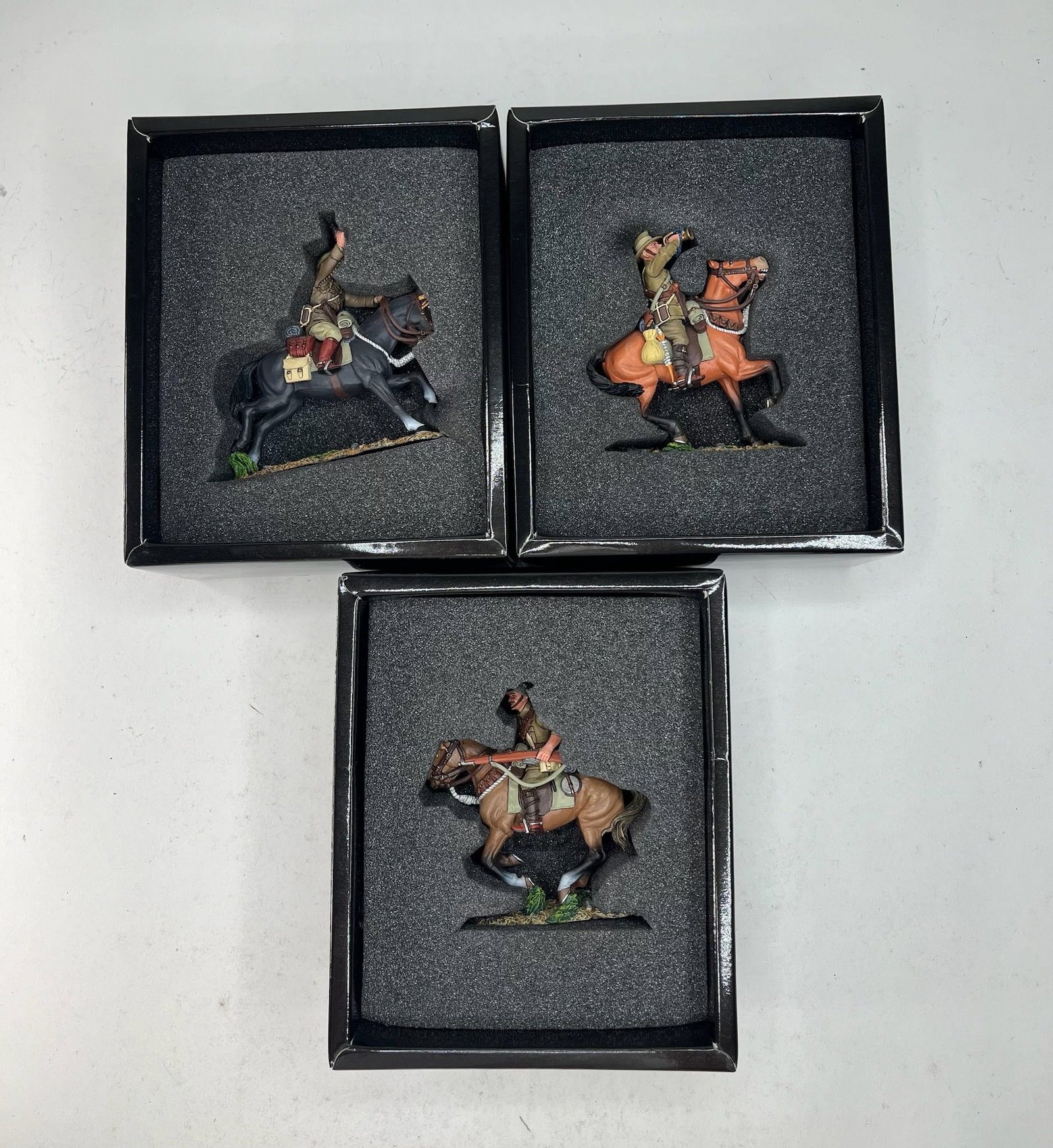 King & Country Australian Lighthorse Assortment: AL001 Australian Lighthorse Officer w/ Pistol, AL002 Australian Lighthorse Bugler, and AL003 Australian Lighthorse w/ Rifle. 3 Pieces. Condition Excellent. Boxes Excellent.