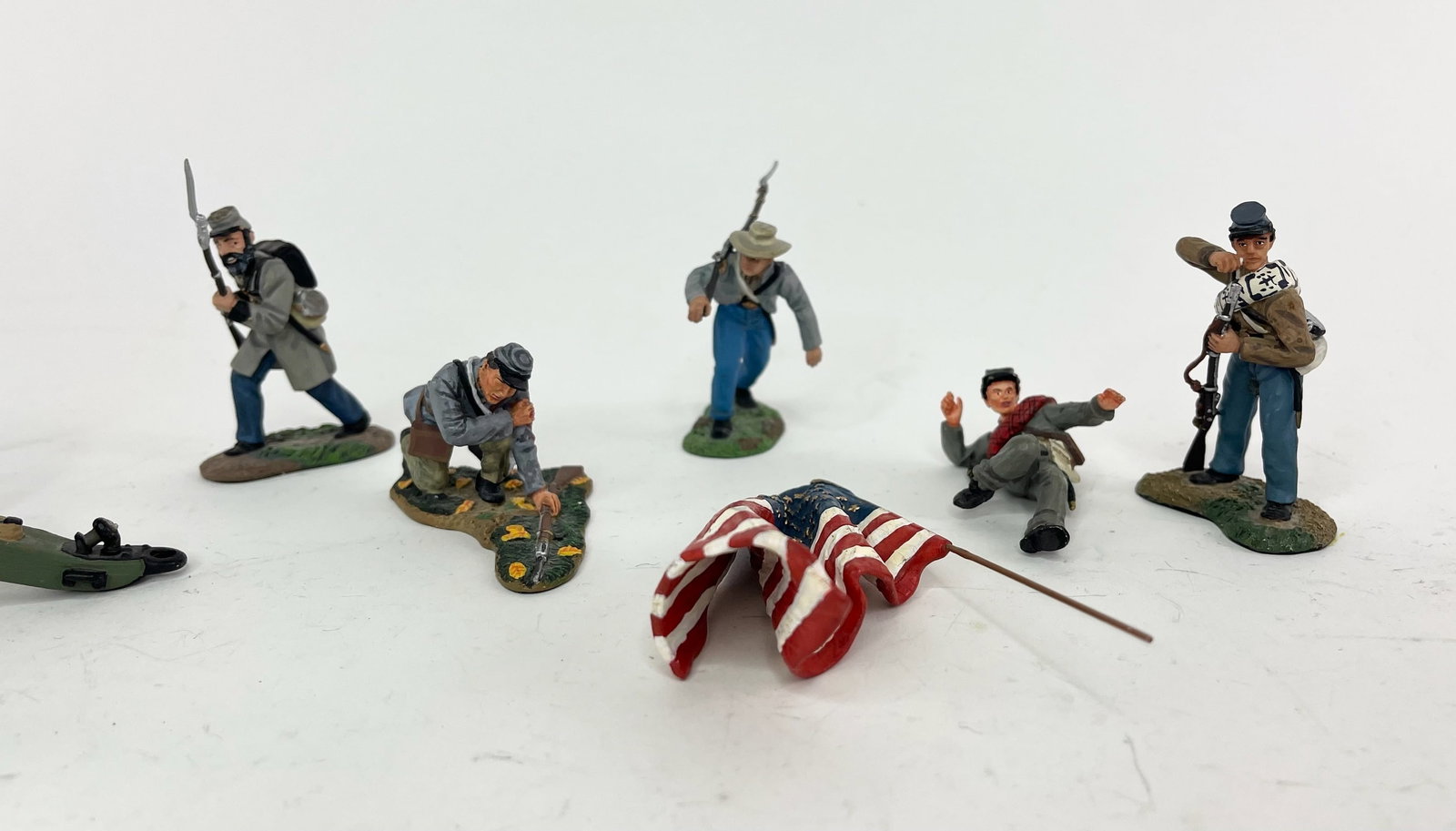 Britains Civil War Assortment: Includes 2 Cannons, 5 Figures, and 1 Flag. 8 Pieces Total. Condition Very Good, Back of 1 Cannon Broken. No Box.