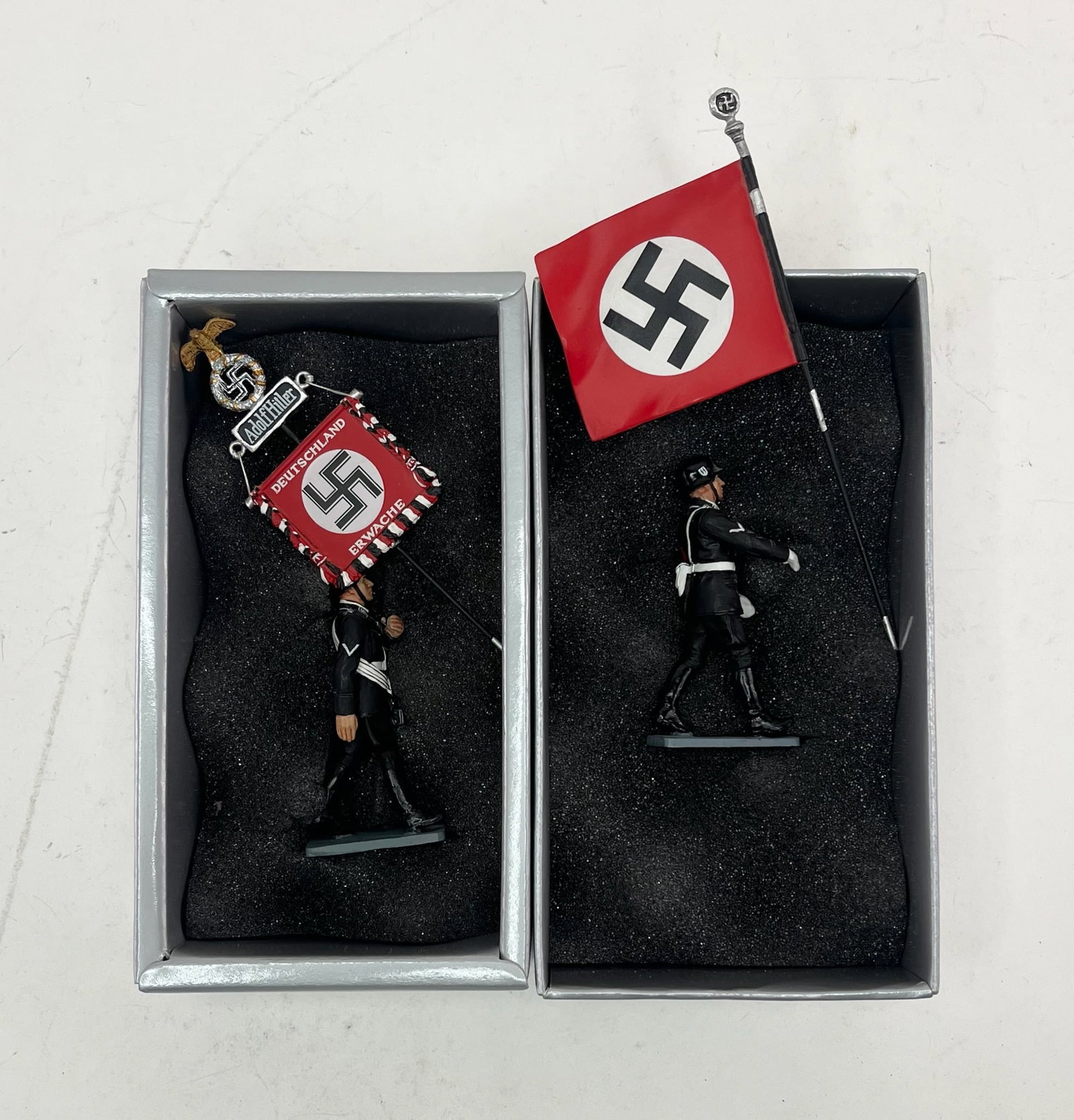 King & Country Leibstandarte SS Figure Set Pair: Includes Sets LAH027 Marching Standard Bearer and LAH029 Blood Flag Bearer. 2 Pieces. Condition Excellent. Boxes Very Good.