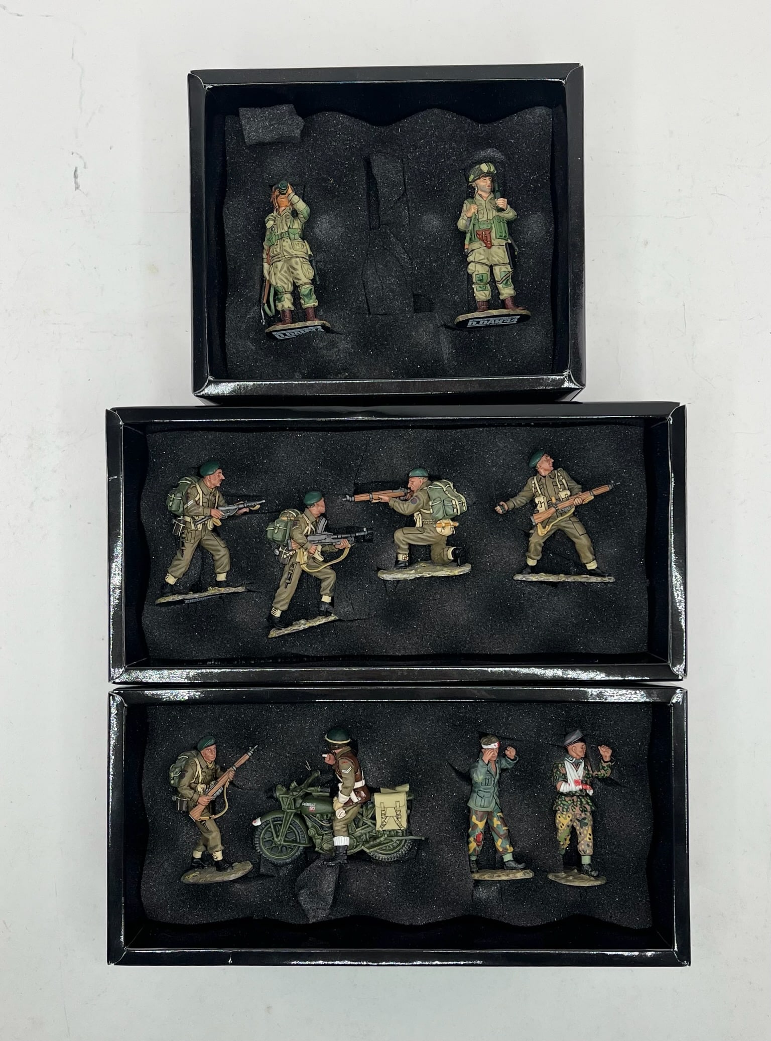 King & Country D Day Set Assortment: Includes Sets DD057 Commando Attack, 4 Pieces, DD058 Taking Prisoners, 4 Pieces, and DD073 The Souvenir Hunters, 2 Pieces. DD073 Missing 1 Figure Holding Nazi Flag. 10 Pieces Total. Condition Excellen