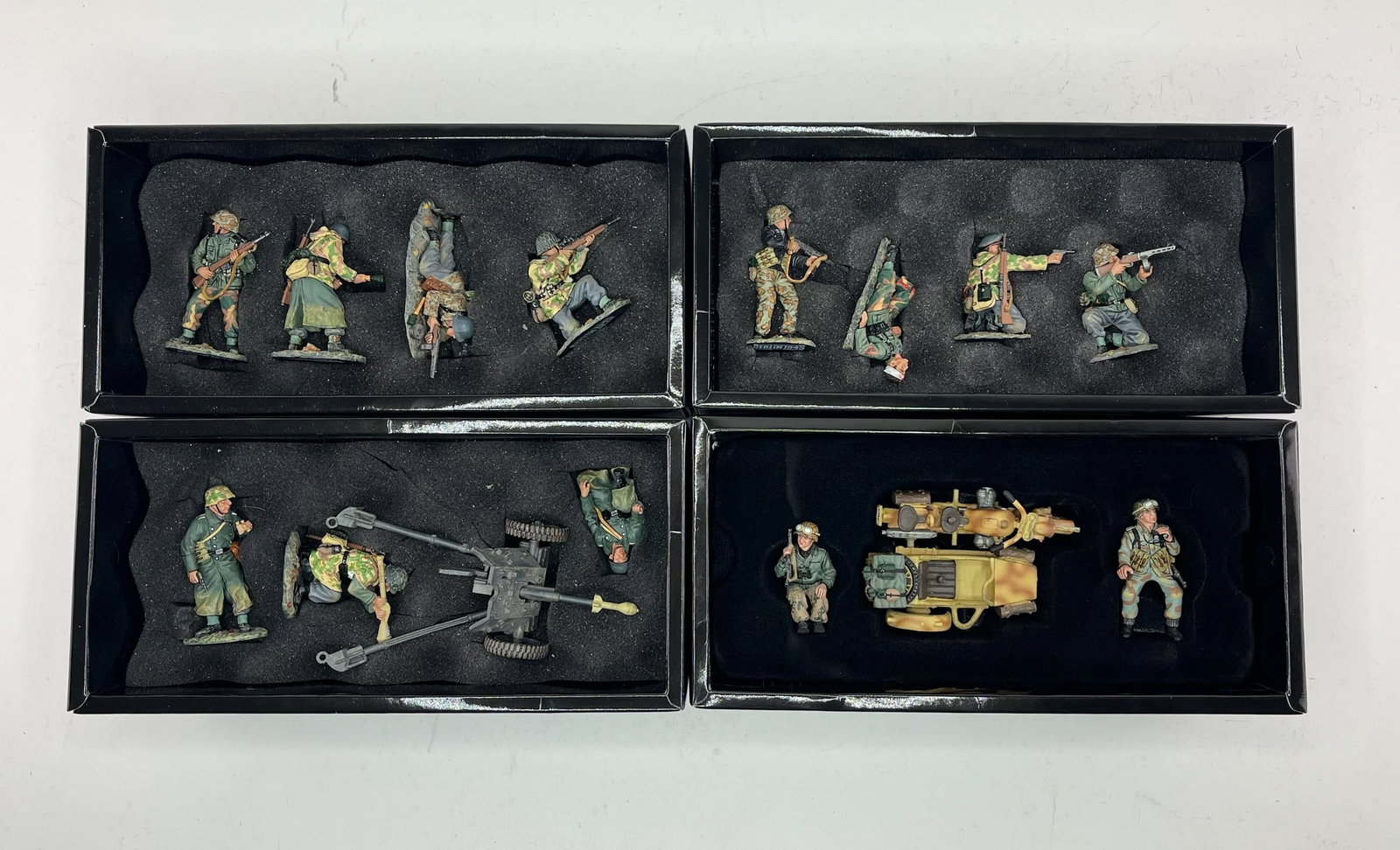 King & Country Waffen SS Set Assortment: Includes Sets WS064 The Russians Are Coming, 4 Pieces, WS065 The Last Stand, 4 Pieces, WS066 Anti Tank Gun Set, 4 Pieces, and WS74 German Motorcycle and Sidecar, 3 Pieces. 15 Pieces Total. Condition E