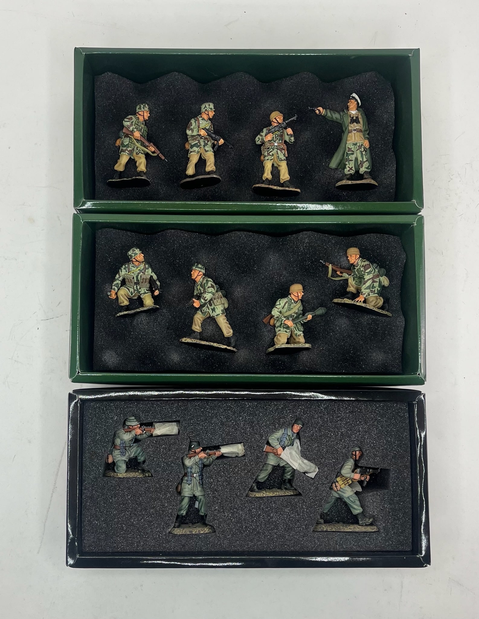 King & Country Fallschirm-Jager Set Assortment: Includes Sets FJ002 The Attackers, 4 Pieces, FJ005 A Four Man Ambush Set, 4 Pieces, and FJ005-07 Returning Fire, 4 Pieces. 12 Pieces Total. Condition Excellent. Boxes Excellent.