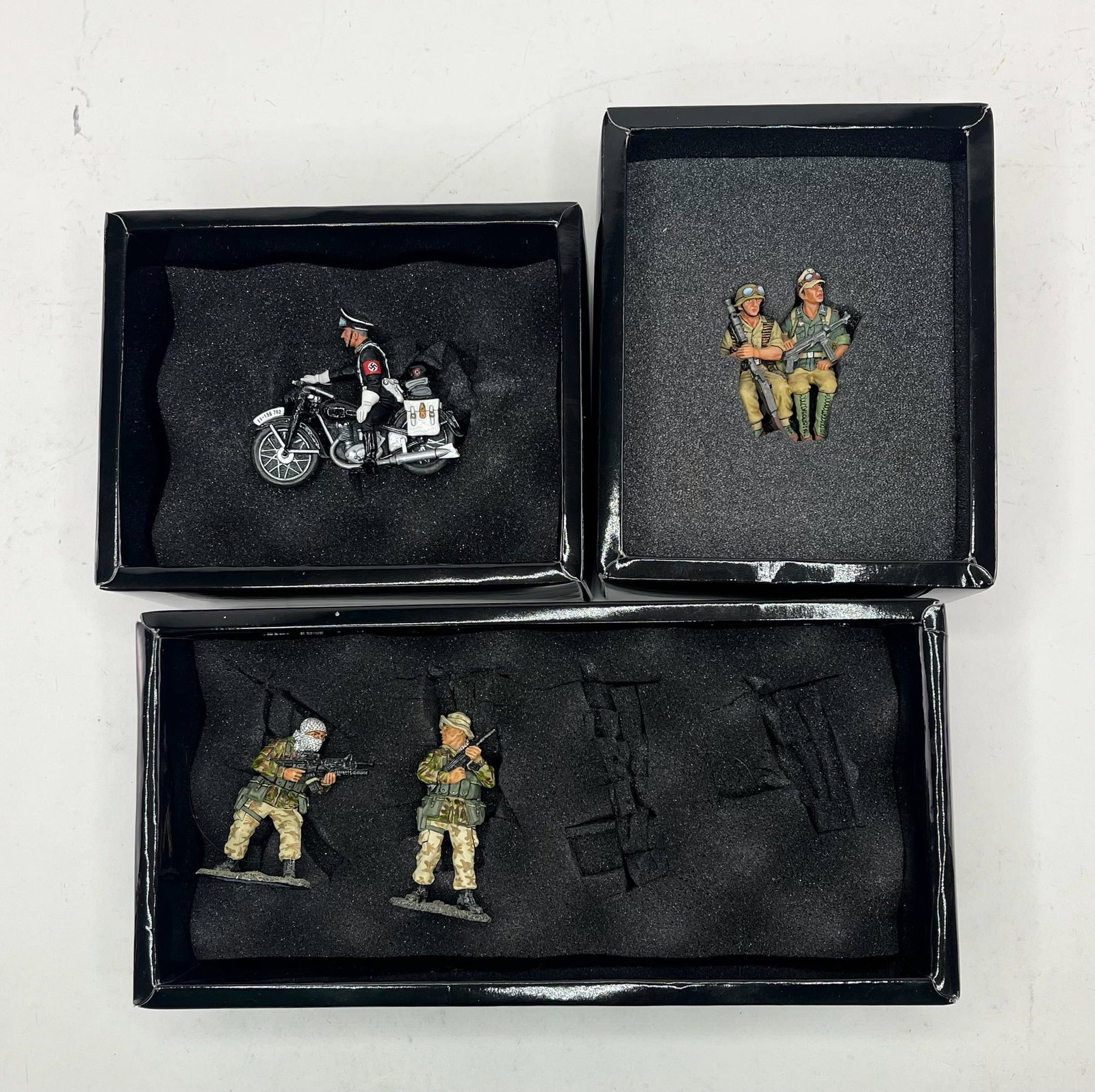 King & Country Assortment: Includes Sets SF01 Freedom Fighters, 2 Pieces Missing 2 Figures, AK045 AK Vehicle Passengers (2-man set), 1 Piece, and LAH55 Motorcycle Escort, 1 Piece. 4 Pieces Total. Condition Excellent. Boxes Exce