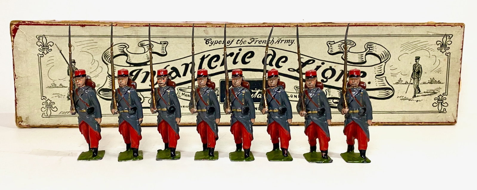 Britains #141 Infanterie de Ligne: Pre war issue. 8 pieces. Near mint condition. Whisstock label box poor.