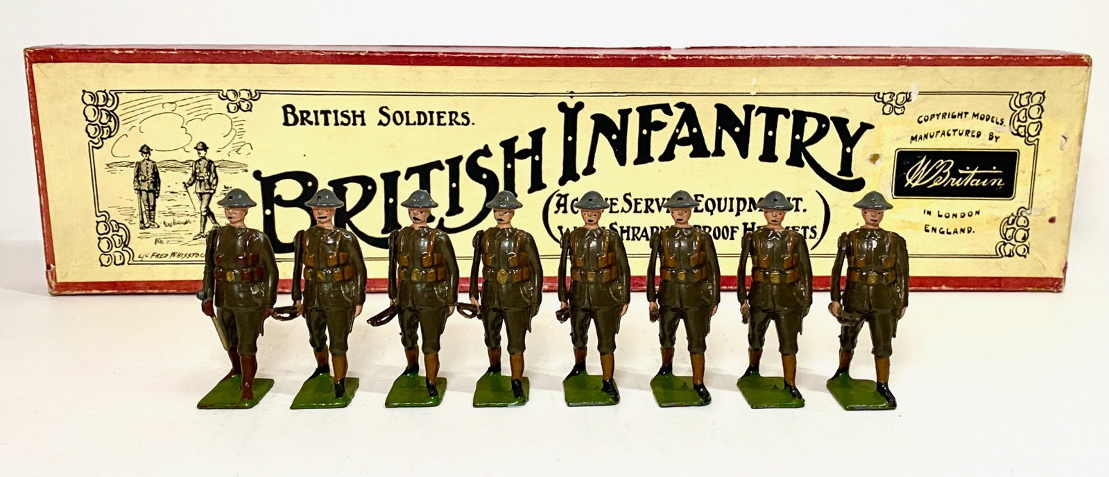 Britains #195 British Infantry: Active Service Dress with Shrapnel Proof Helmets. 8 pieces. Pristine condition. Whisstock label box excellent.