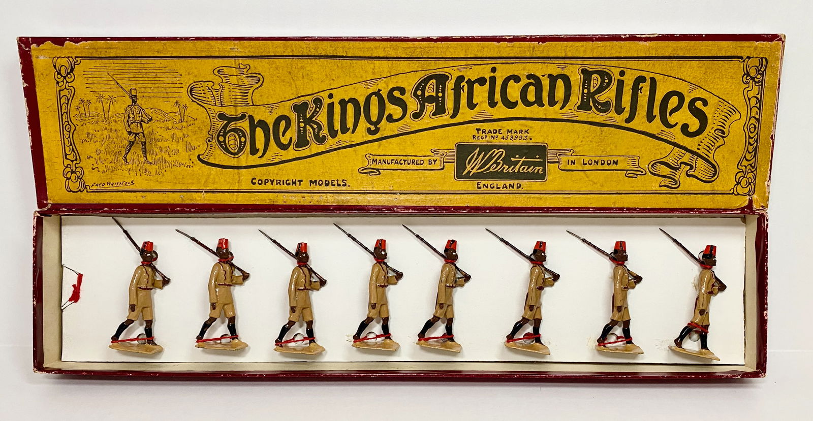 Britains #225 The King's African Rifles: Recast and well painted. Tied to replacement card in Whisstock label box. 8 pieces. Box good.