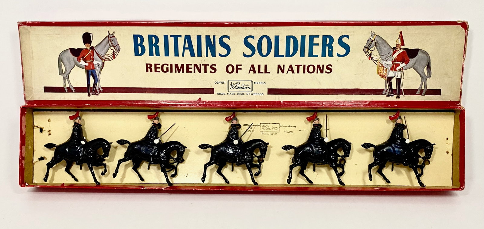 Britains #1343 The Royal Horse Guards Cloaked: Post war issue. 5 pieces. Mint to near mint condition, tied to card in ROAN label box. Box fair taped corners.