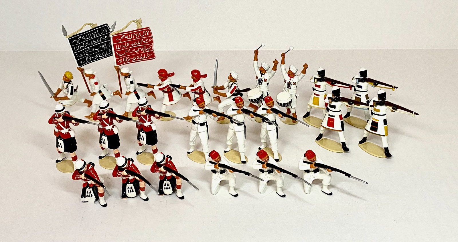 Large Assortment of Imperial Figures: Black Watch Highlanders firing, Egyptian Infantry, Mahdiists, and Sudan Riflemen. 24 pieces. Mint to near mint condition. Unboxed.