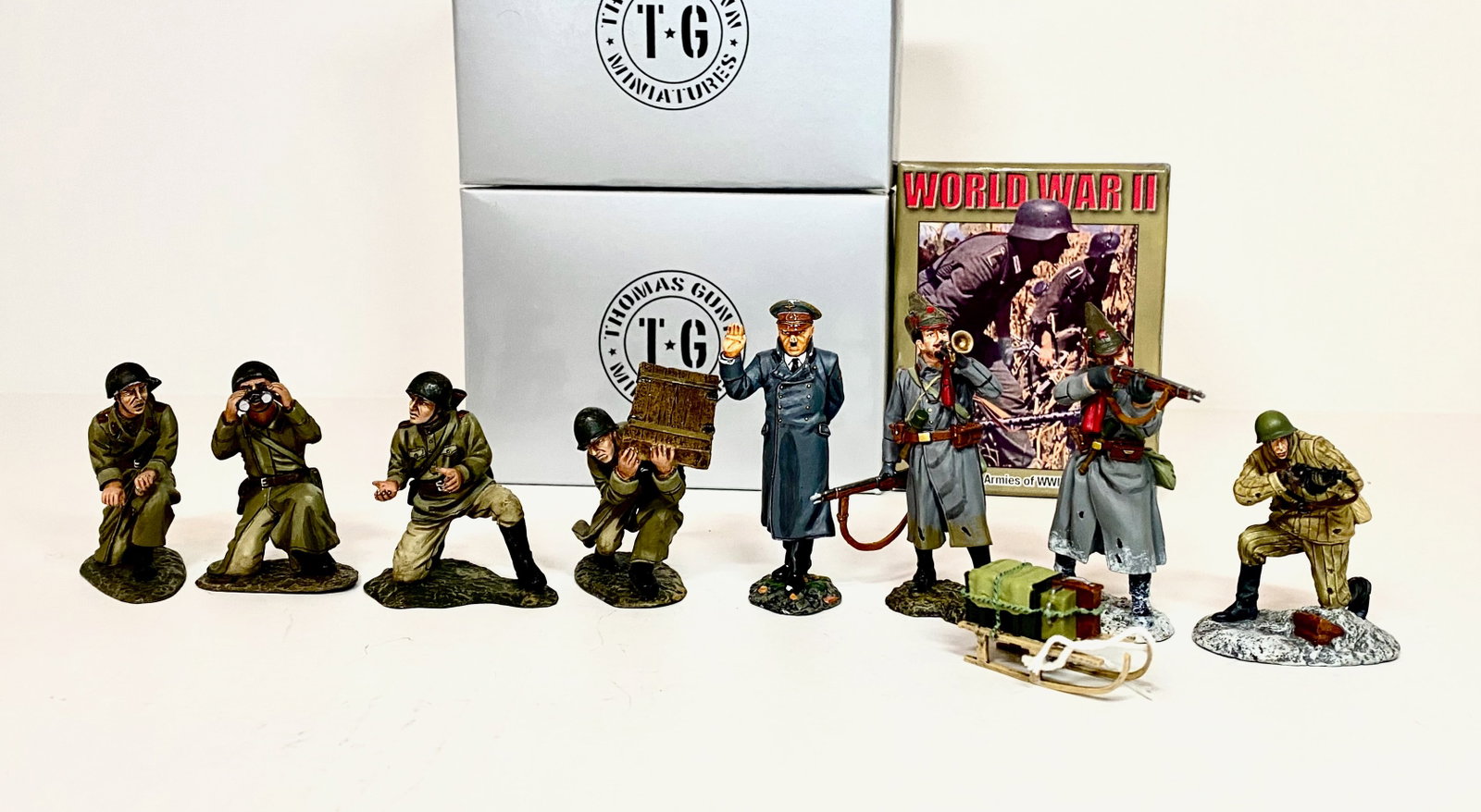 World War Figures: Thomas Gunn Russians, Figarti and First Legion Infantry men, Plus King & Country Hitler. 9 pieces. Mint to near mint condition. Figarti & K&C figures unboxed, other boxes in excellent condition.