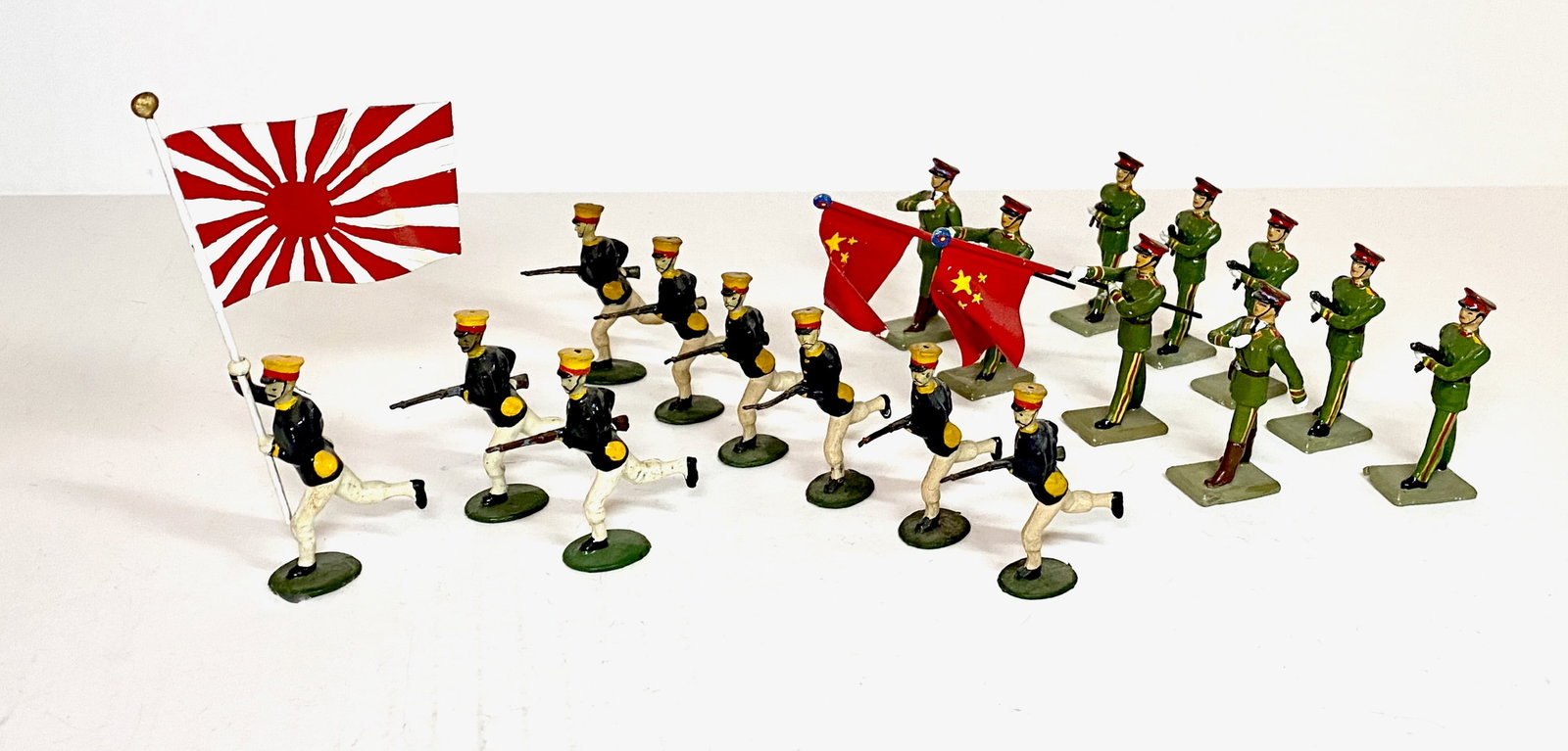 Japanese & Chinese Infantries: Britains Japanese infantry (some retouching with a wonderfully converted Flag Bearer). Unbranded modern maker Chinese Infantry. 19 total pieces. Near mint to excellent condition. Unboxed.