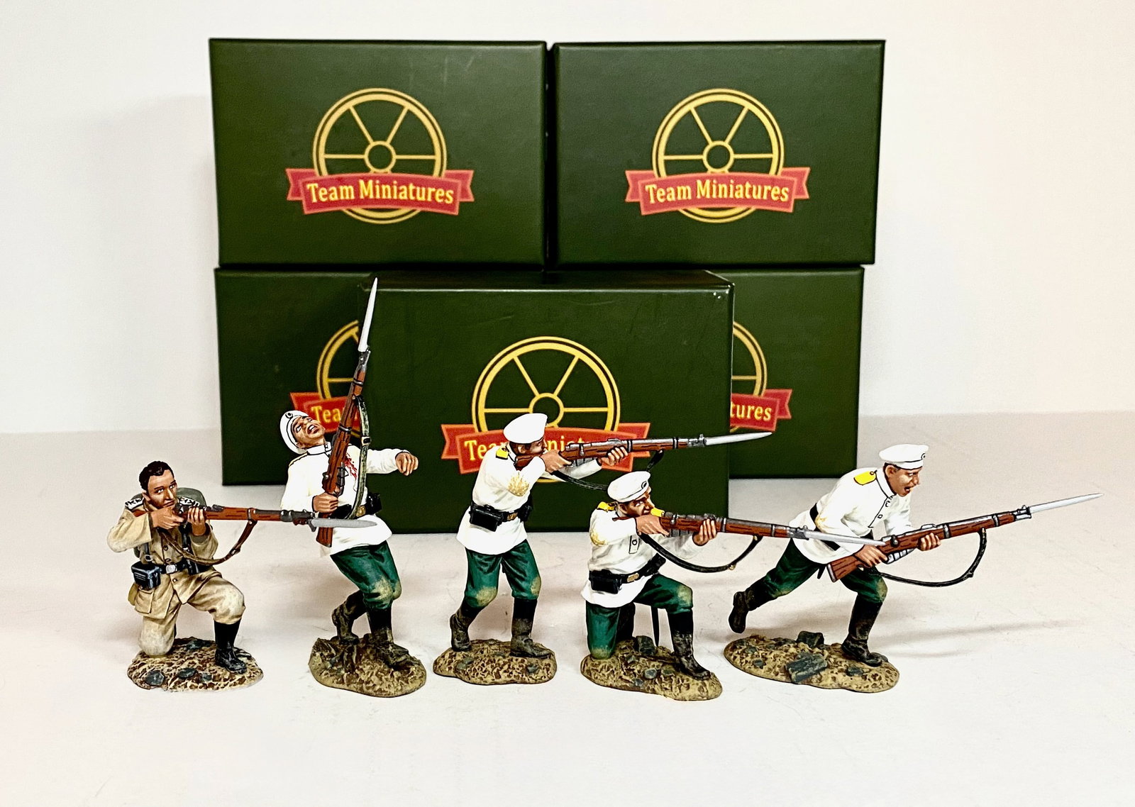 Team Miniatures Figures: GM Kneeling Firing without Cap, and four Russian Soldiers in action. 5 pieces. Mint condition. Boxes excellent.