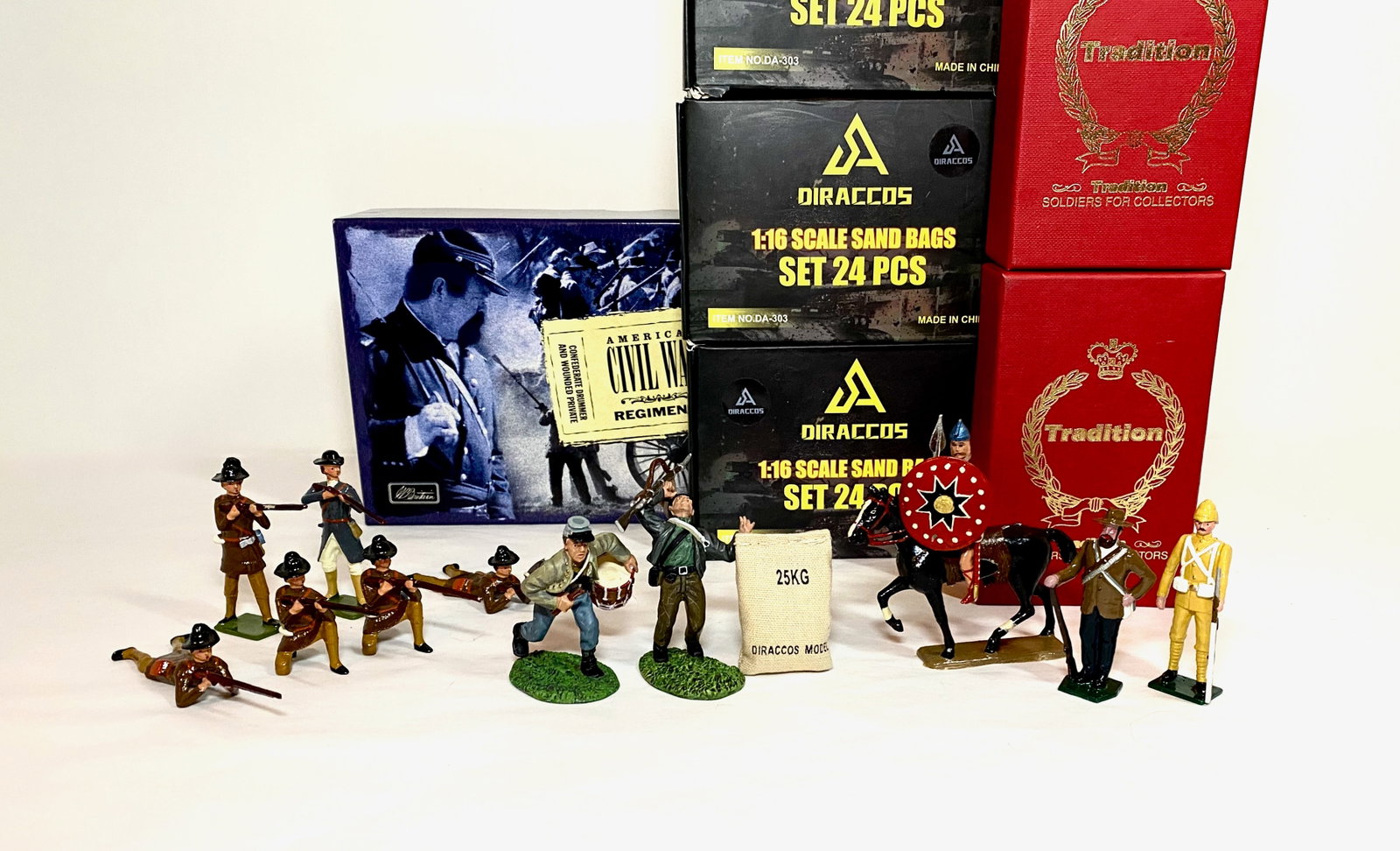 Assorted Soldiers, Modern Makers: Britains #17109 Confederate Drummer & Wounded Private, Tradition Boer War Figures, Diraccos Sandbags, Mignot Mounted Gaul, and Hocker Pennsylvania Rifle Regiment. 11 figures plus 72 sandbags. Mint to 