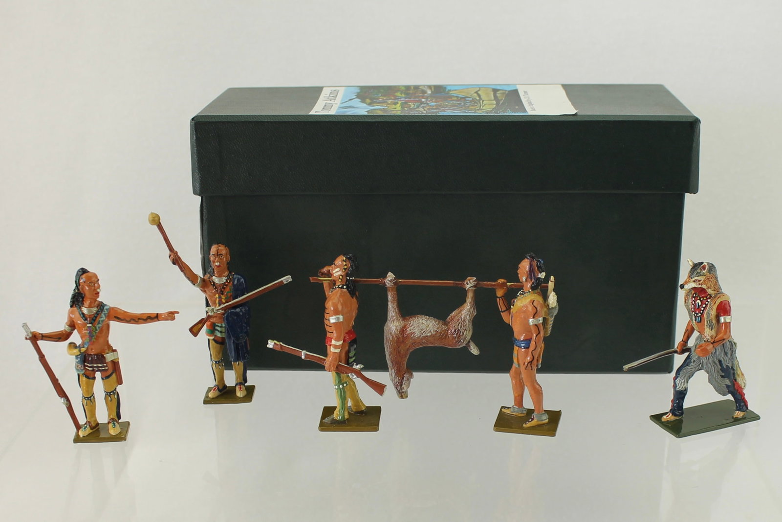 Tommy Atkins Lot Native American Hunting Party: French and Indian War. Set includes 2 Braves Carrying Deer on Game Pole, Medicine Man, Brave in Wolfskin and Brave Holding Rifle. 4 Pieces. Condition Very Good to Excellent. One Warrior Hand Detached 