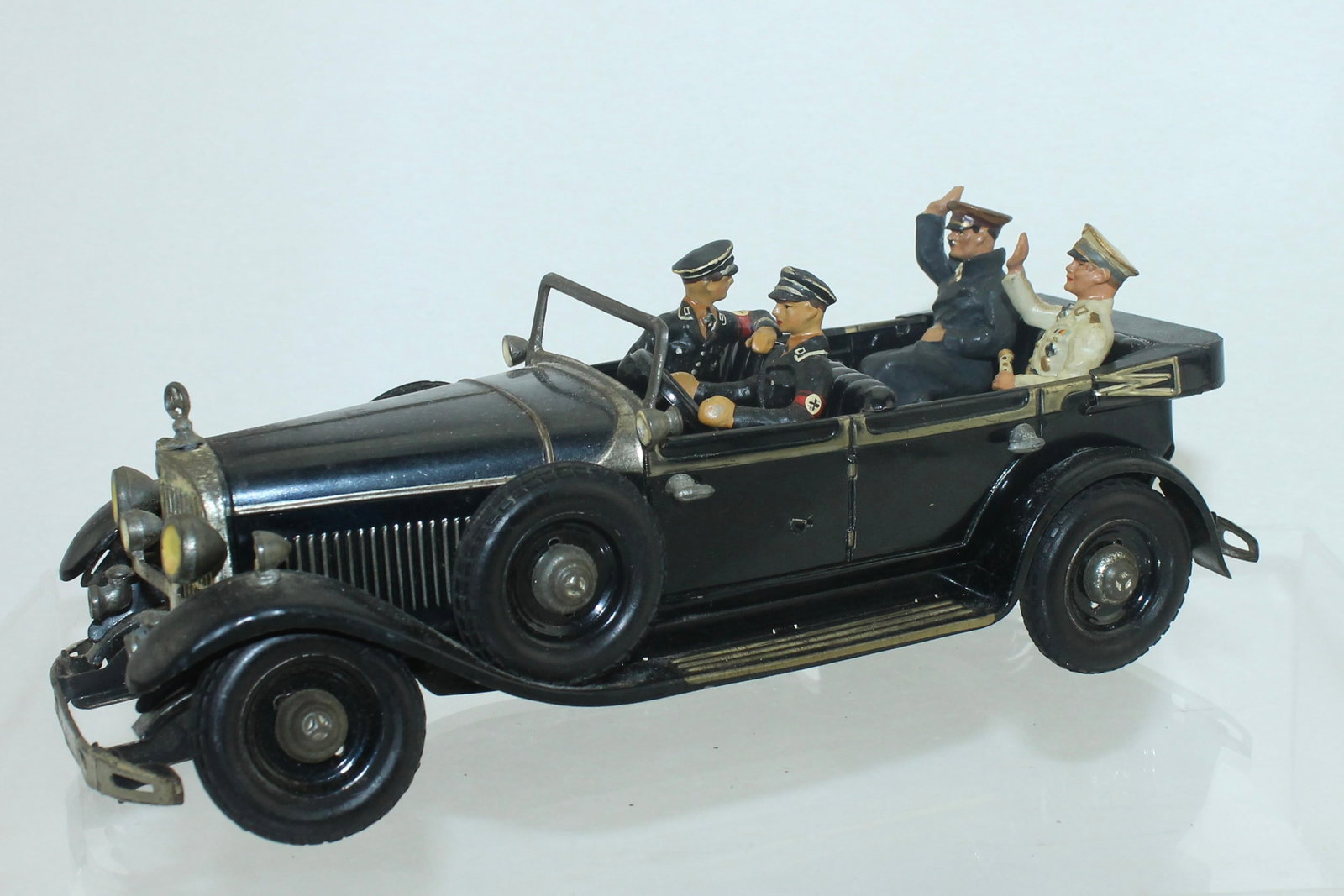 Tipp Co Tin Plate Fuhrer Wagon: Tin Plate Fuhrer Wagon with Rubber Tires. Comes with Reproduction Figures of SS Driver and SS Adjutant Leaning over Back Seat, Seated Hitler with Movable Arm and Goering Holding Marshal's Baton. Clock