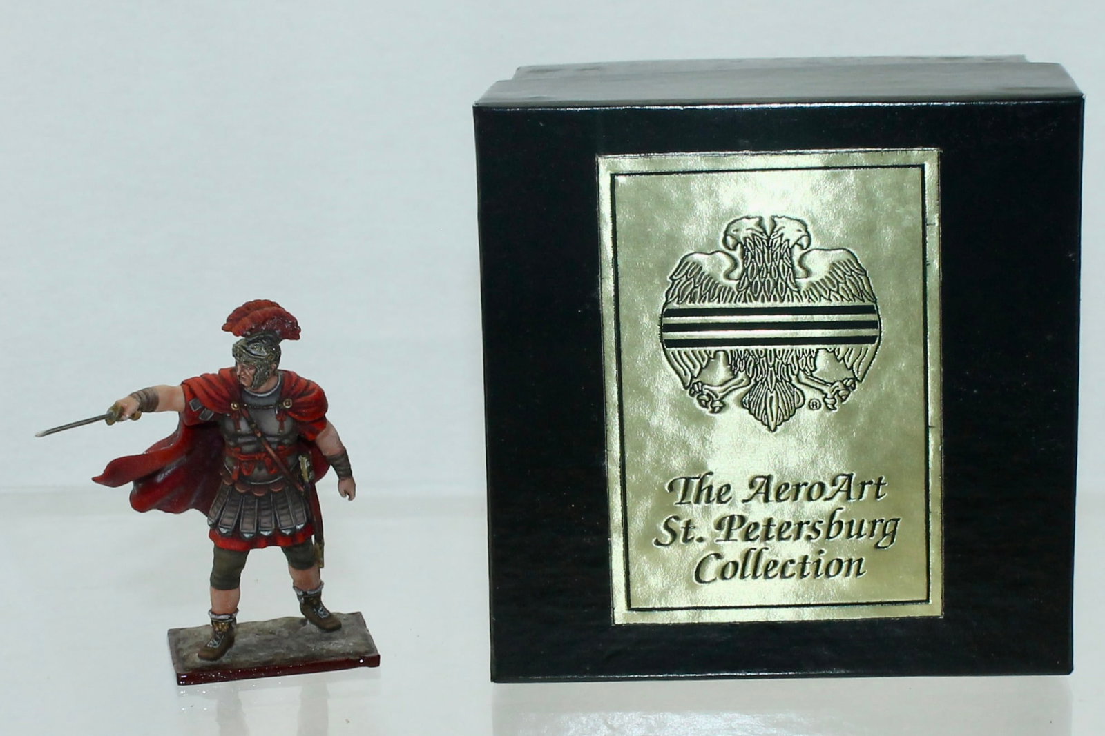 Aero Art Emperor Tiberius: St. Petersburg Collection. 6289 on Underside of Base. 1 Piece. Condition Very Good to Excellent. Oxidation to Paint on Cape. Box Very Good.