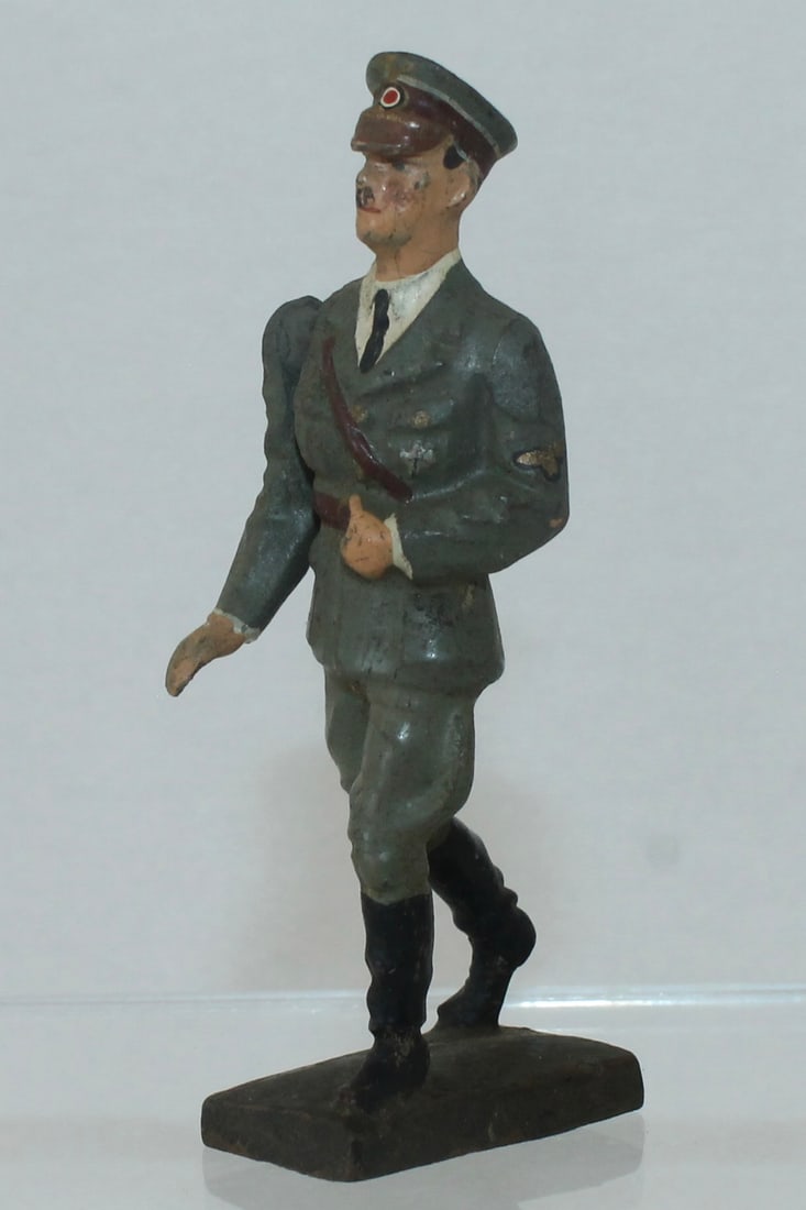 Lineol Hitler Walking in Green Uniform: 5/2. Movable Arm. Made 1936-40. 1 Piece. Condition Very Good. Crack Across Back. No Box.