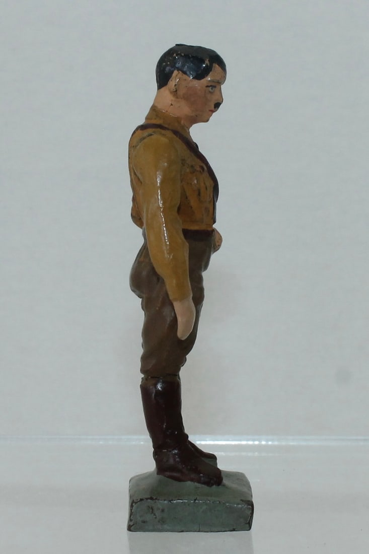 Lineol Hitler Standing from Podium in Brown Shirt: 9/3. Movable Arm and Standing with Head Looking Down from Podium (not included). Made 1933-36. 1 Piece. Condition Very Good to Excellent. No Box.