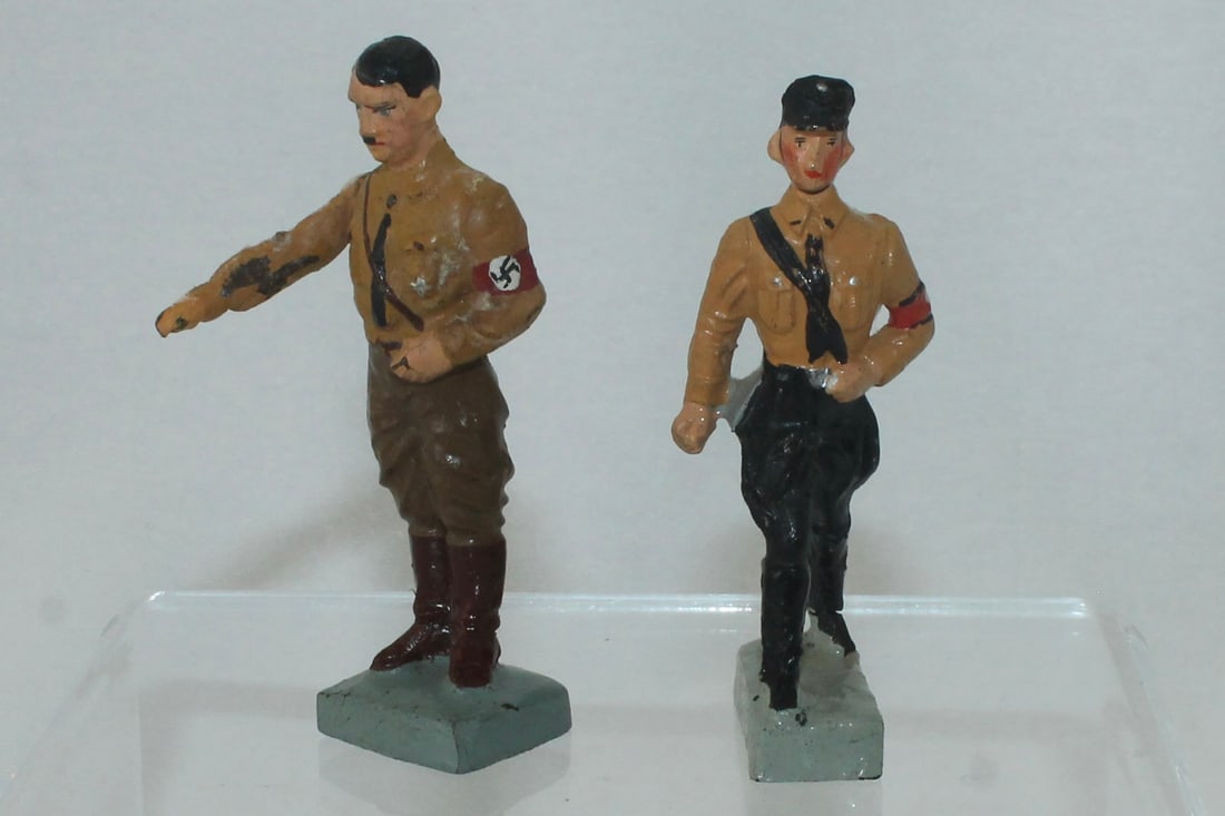 Lineol Hitler Standing in Party Uniform: 5/1. Movable Arm. Also Includes SS Man Marching by Another Maker. 2 Pieces. Condition Very Good to Excellent. No Box.
