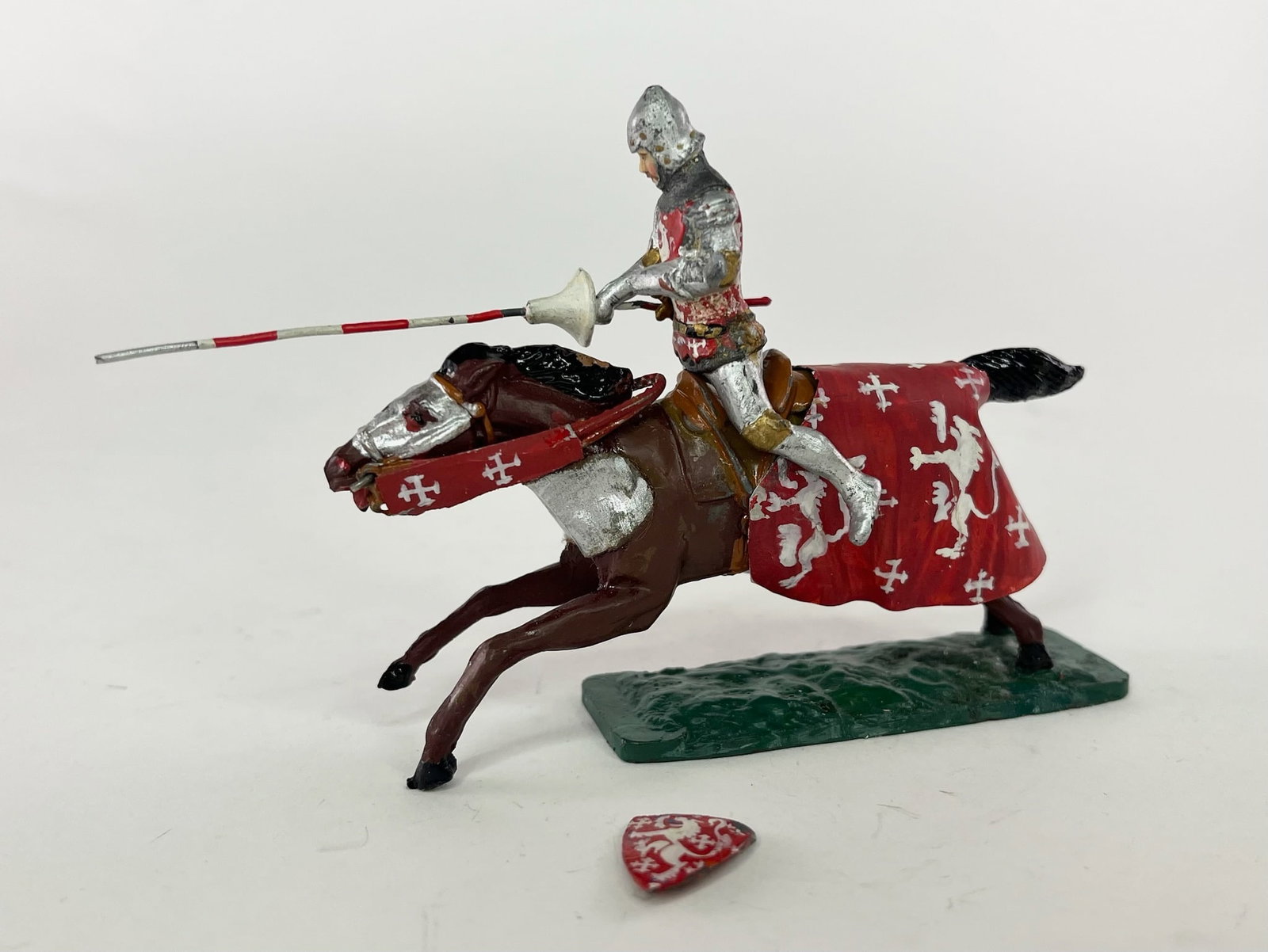 Courtenay Conversion: Original Courtenay figure with lance mounted on a Warren horse. Horse decorated in matching medieval robes. Condition Excellent. Shield detached; but present for repair. No Box.