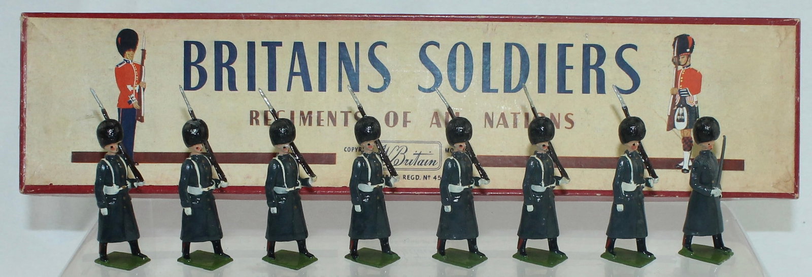 Britains Set 312 Grenadier Guards Great Coats: Post War. 8 Pieces. Condition Excellent. Box Very Good. Tie Card Creased.