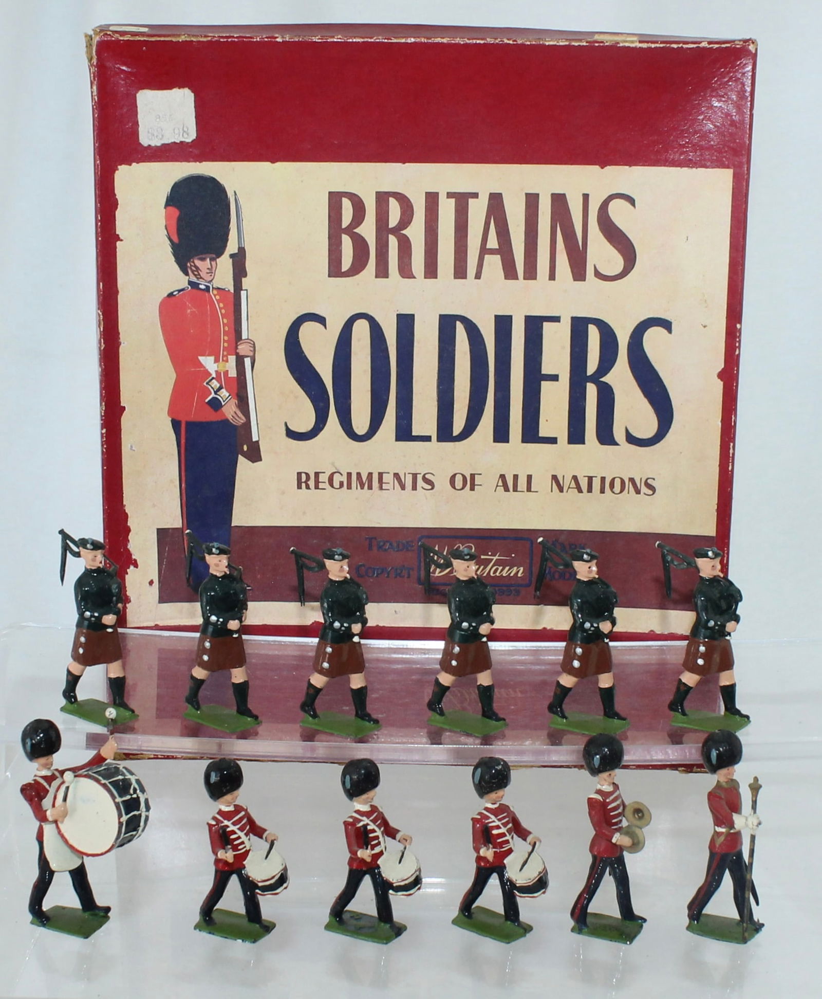Britains Set 2096 Irish Guards Band: Pipes and Drums Band of the Irish Guards. Made 1954-55 only. Metal Drums. 12 Pieces. Condition Excellent. Box Good. Split Corners. Price Sticker Affixed to Top.