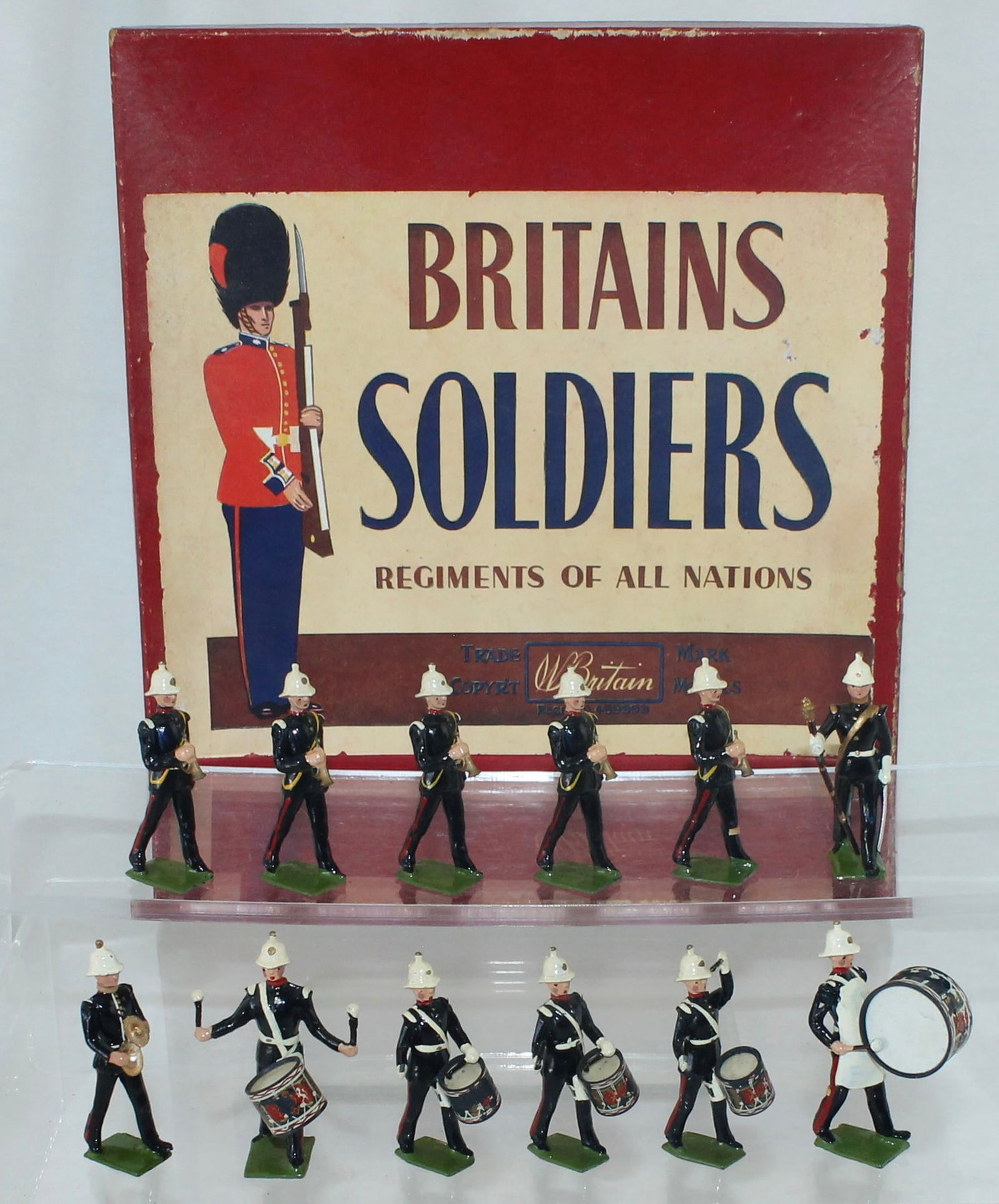 Britains Set 2115 Royal Marine Drum and Bugles: With Plastic Drums. Made 1956 only. 12 Pieces. Condition Very Good to Excellent. Drum Decals Distressed. Box Very Good.