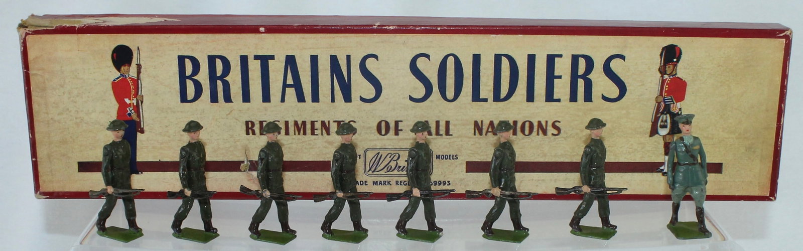 Britains Set 1603 Irish Infantry in Battle Dress: Republic of Ireland Infantry. Made 1950-59. 8 Pieces. Condition Excellent. Box Fair to Good. Lacks Tie Card. Box Top and Bottom Mismatched.