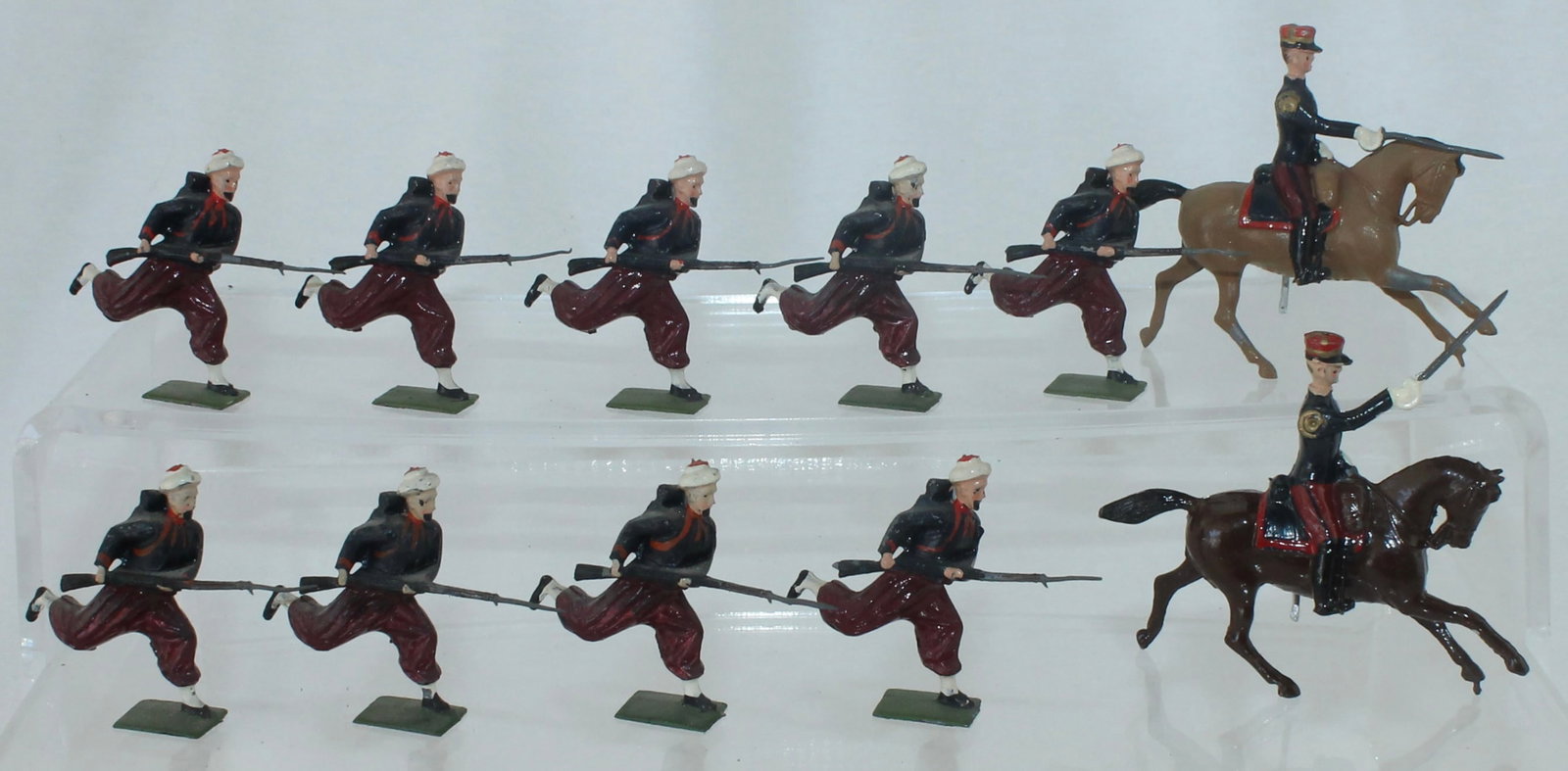 Britains From 9166 French Zouaves Charging: Includes 4 Additional Zouaves and Officer. 11 Pieces. Condition very Good to Excellent. Paint Chips on One Officer's Horse Legs. No Box.