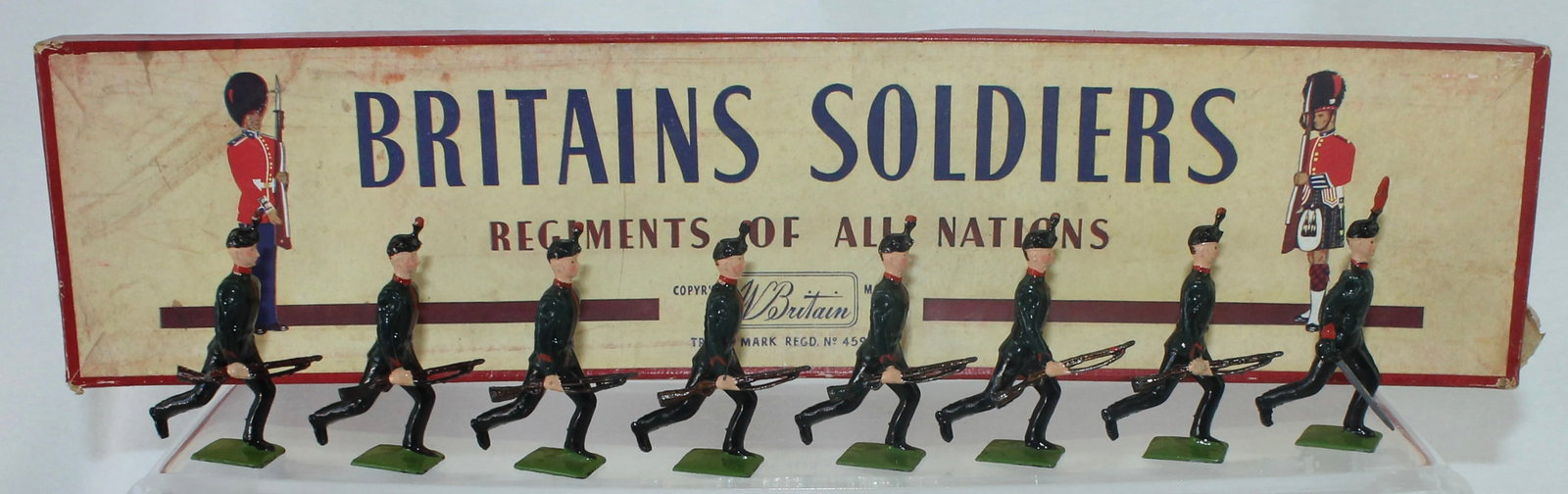 Britains Set 98 Kings Royal Rifle Corps: Running at the Trail. 8 Pieces. Condition Excellent. Box Good to Very Good. Slightly Warped.