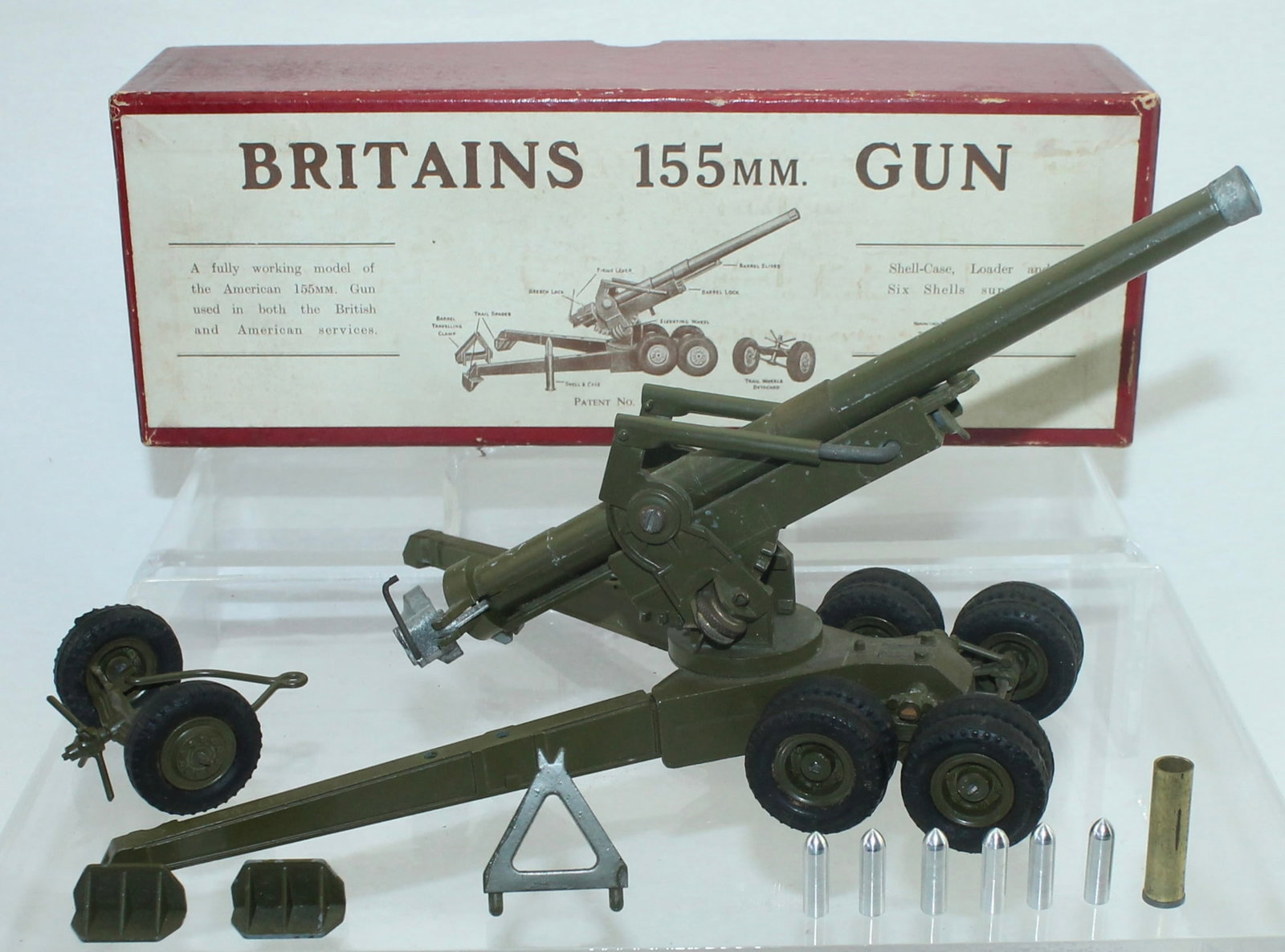 Britains Set 2064 US M1 155mm Gun: Includes 2 Trail Spikes and 6 Projectiles. 5 Pieces. Condition Good to Very Good. Lacks Correct Ammunition Shell with Spring. Box Very Good.