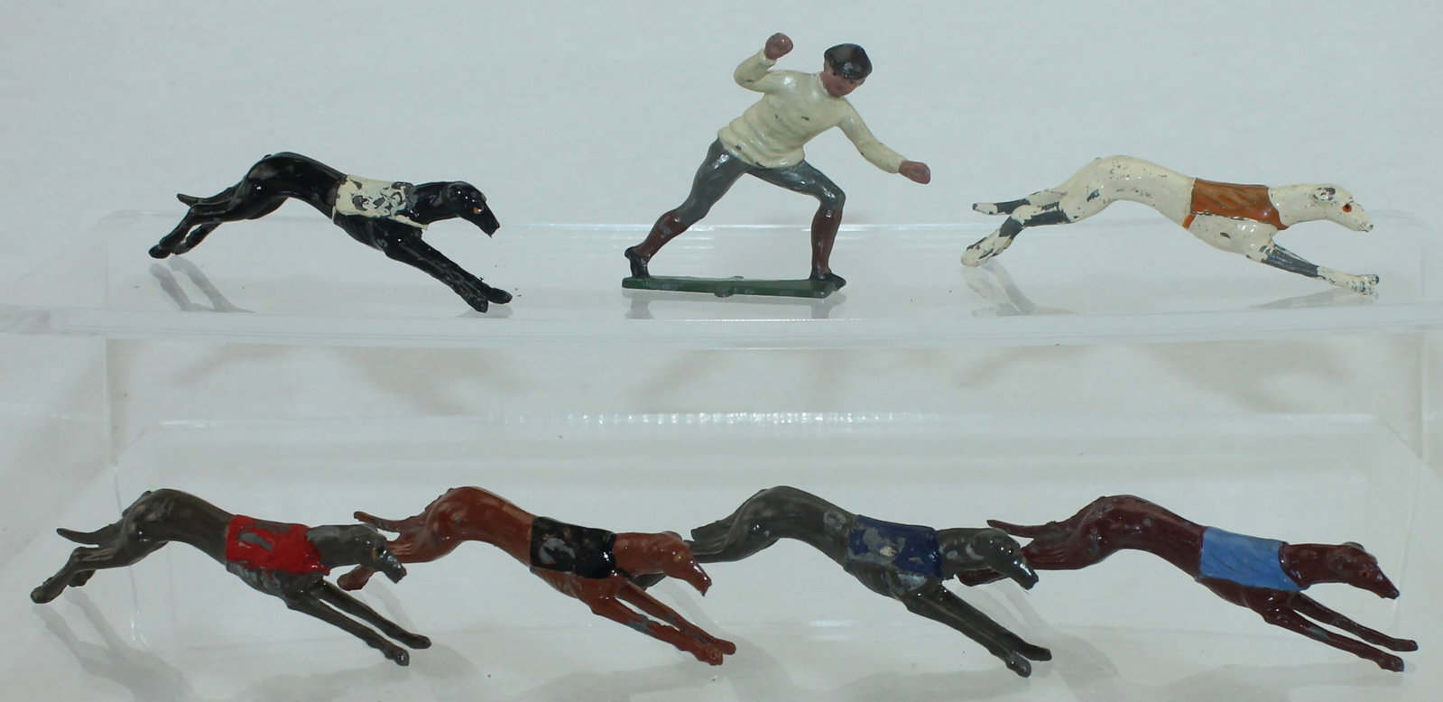 Johillco Lot Greyhound Race: Includes 6 Dogs and Race Starter. 7 Pieces. Condition Good to Very Good. Some Paint Loss to Dogs. No Box.