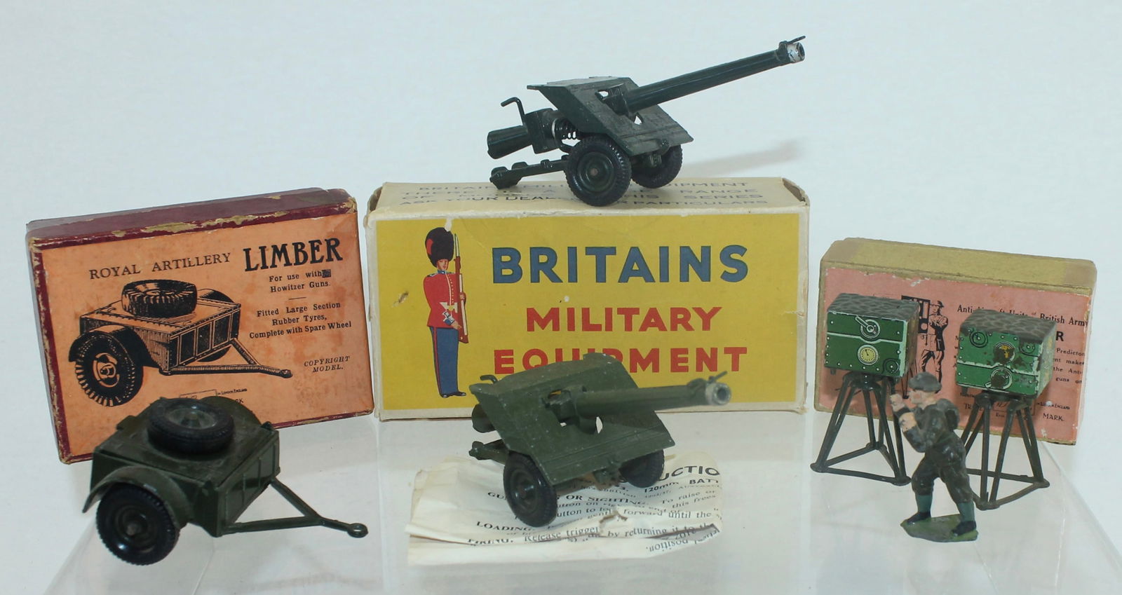 Britains Lot BAT Gun Limber Predictor: Lot Includes 1728 Predictor with Operator, 1726 Regulation Limber and 2173 B.A.T Gun. Also includes a Second Predictor and B.A.T Gun. 6 Pieces. Condition Good to Very Good. Boxes Fair to Good.