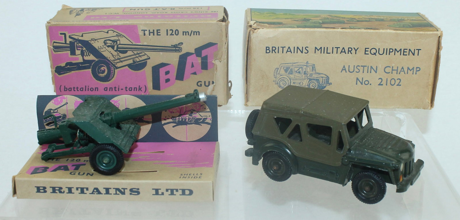 Britains Lot BAT Gun Austin Champ Vehicle: Lot includes 2102 Austin Champ and 9720 B.A.T. Gun. 2 Pieces. Condition Fair to Good. Boxes Poor to Good. BAT Gun Box End Flap Torn but Present.