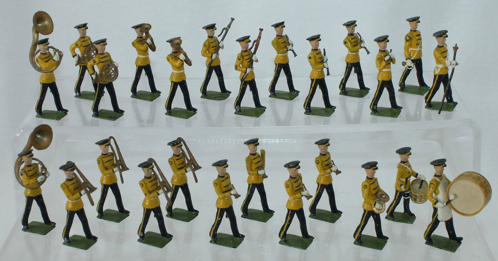 Britains Set 2110 U.S. Military Band: In Full Dress Uniform. Made 1956-59. Plastic Drums. 25 Pieces. Condition Good to Very Good. Drum Decals Distressed. Side Drum Cracked. No Box.