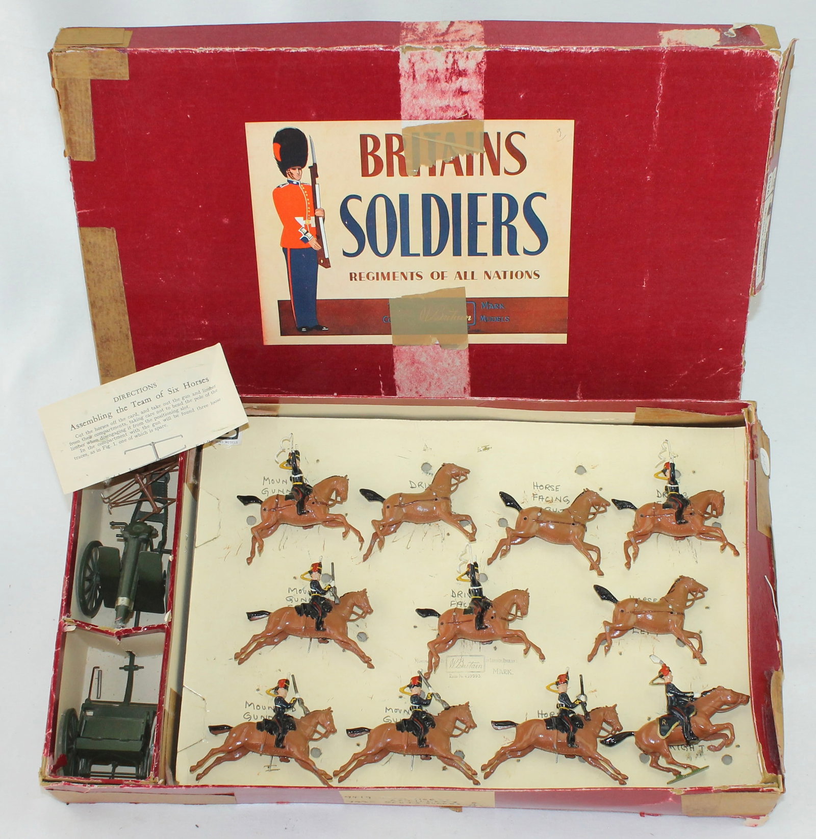 Britains Set 9419 Royal Horse Artillery Gun Team: 13 Pieces. Condition Very Good. Box Poor to Fair. Scuffs on Lid From Sticky Tape. Sticky Tape on Bottom and Top. Ink Writing on Tie Card.