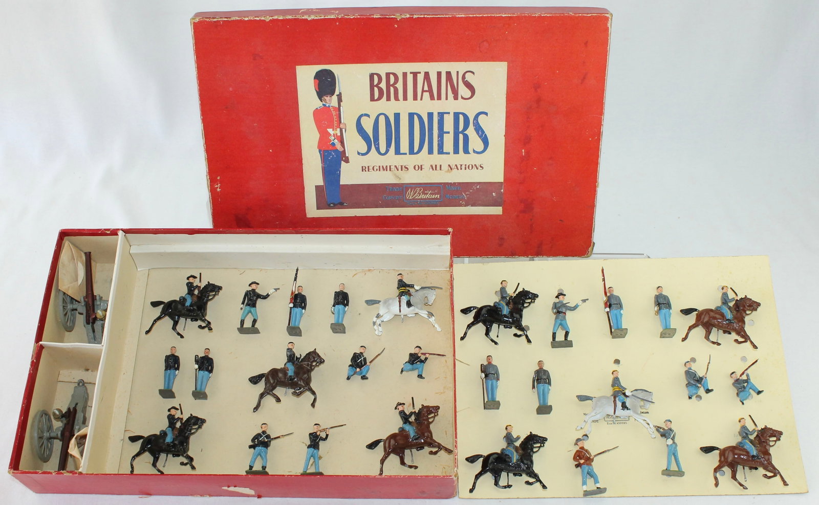 Britains Set 2070 ACW Union and Confederate: Infantry Mounted and Foot with Artillery. 30 Pieces. Condition Good to Very Good. One Confederate Cavalry missing Rifle. Union Officer Missing Sword. Bugler's Arm Broken. Some Horse Legs Bent. Box Fai