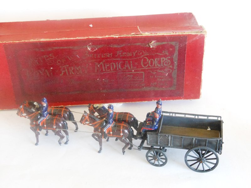 Britains Set # 145 Royal Army Medical Corps: Britains Set # 145 Royal Army Medical Corps Wagon Breast Harness with Original Box Pre War 7 Pieces. Condition Good (No Canvas, 2 Helmet Balls Missing) Box Fair (Lid Split and part of edge missing)