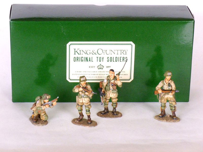 King and Country D Day #1 Soldier: King and Country D Day #1 Soldier crouching, 2 soldiers standing with guns, a soldier talking on radio, 4 pieces with Original Box Condition Excellent. Box Excellent