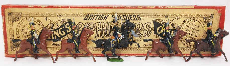 Britains Set #13 King’s Own 3rd Hussars: With original partitioned box. Extremely rare 1st version. Donkey horse with short carbines. Officer on rearing Germanic horse with tin sword and throat plume. Circa 1899. 5 Pieces. Condition: Excelle