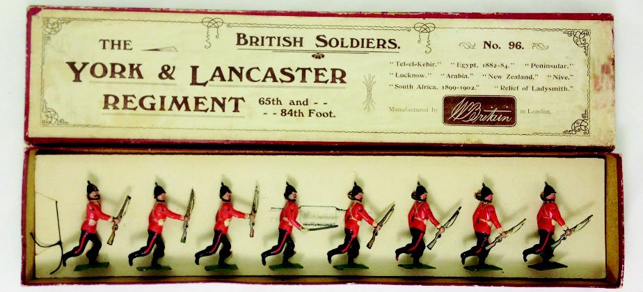 Britains Set #96 York and Lancaster Regiment: Tied in original box. Pre War. Circa 1905. Red tunics running at the trail. 8 Pieces. Condition: Very Good, 2 rifles missing tips.
