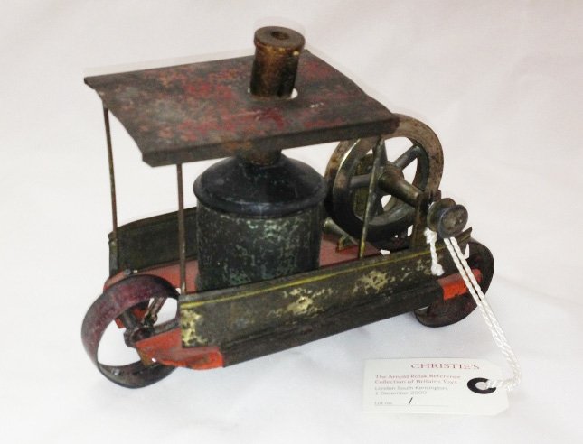 Britains Road Roller: Fly wheel driven tin plate in cast metal. May have been produced as early as 1850. From The Arnold RolackReference Collection sold at Christie’s AuctionHouse London. Pictured on page 16 of NormanJop