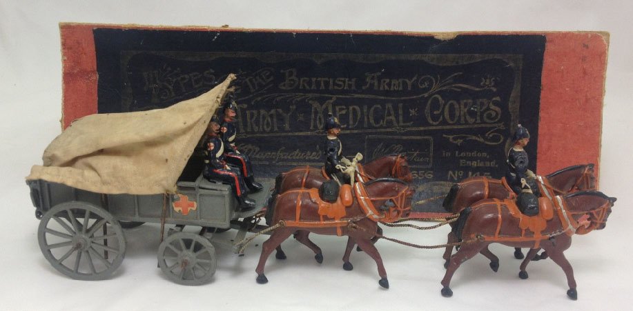 Britains Set #145 Royal Army Medical Corps: Royal Army Medical Corps Ambulance with original box. 1st version heavy horse collar with twisted traces and spiked helmets. Circa 1910. 7 Pieces. Condition: Very Good, box top missing all edging.