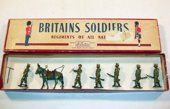 Britains: Set #1893 Royal Indian Army Corps: Service Corps. Post War. Tied on replacement card, Sepoy, one baton, 4 at trail arms one mule, in Britains Regiments box, (NM, Box G).