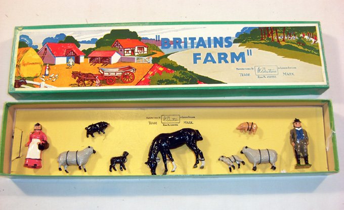 Britains: Set # 54 F. Britains Farm: Comprising farm wife, small pig, sheep, lamb, horse, sheep, lamb, small pig and farmer, tied in original box. Post war. (M, Box E) [9].