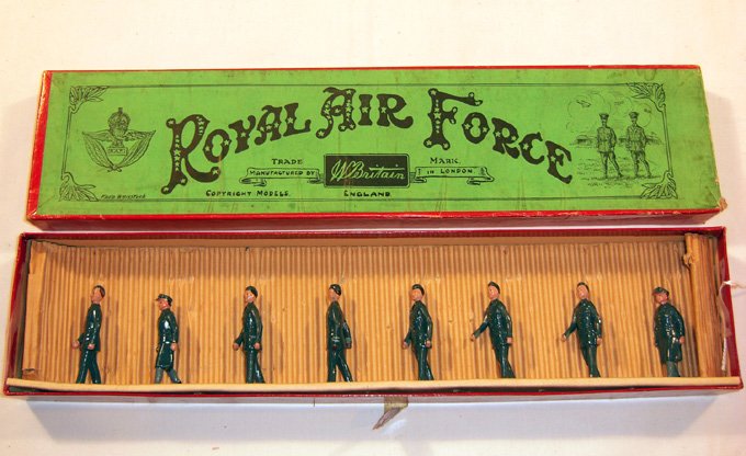 Britains: from Set #240 & #1894 Royal Air Force: Comprising 2 female figures in greyish blue uniforms, 5 infantry in similar uniforms and one officer with light blue cuffs and white insignia on chest in “Whisstock” box (NM,Box G, water damage) (