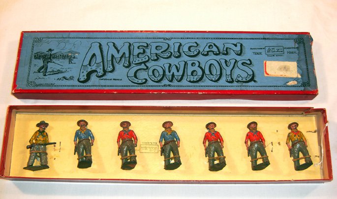 Britains: Set # 183 American Cowboys: 7 with stationary arms, in original “Whisstock” box (VG, box P, paper label) [7]