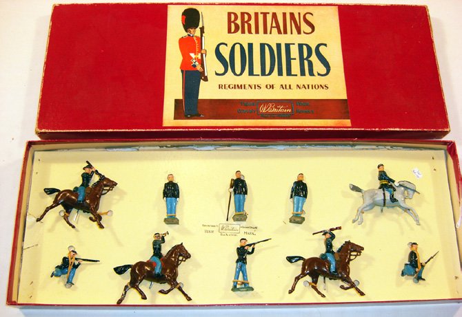 Britains: Set #2069 Civil War Union Cavalry: And Infantry 1862. 4 mounted including officer and bugler, 1 kneeling at the ready, 1 standing firing, 1 kneeling firing, 1 cannon loader and others, in original “Regiments” box (10) (NM, Box P). 