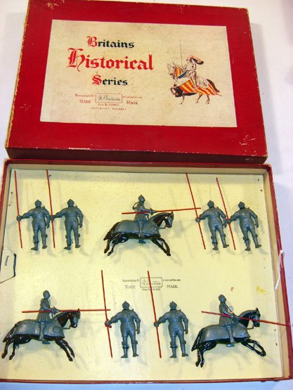 Britains: Set # 1307 16th Century Knights: In Armour. Mounted and on Foot, 3 mounted and 6 foot, tied in original “Regiments” box (soldiers have dull finish. Box G) [18]. Figures VG.